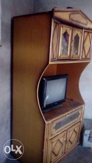 Black Crt Television And Tv Hutch