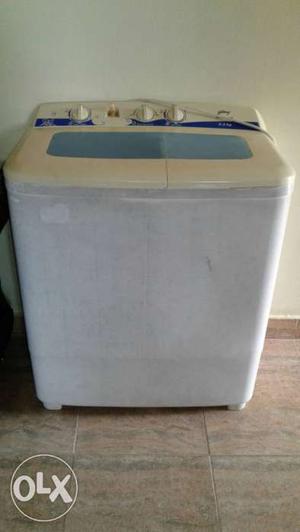 White And Beige Washer And Dryer Combo