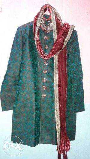 Green Traditional Dress And Red And Gray Scarf