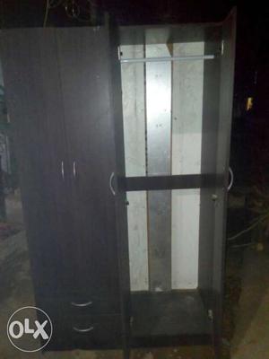 Black Wooden Wardrobe price negotiable...urgently need to