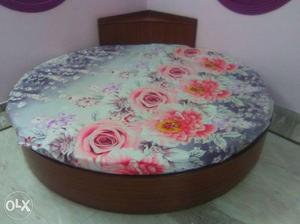 Brown Wooden Round Bed with mattresses and side