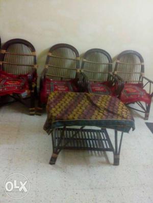 Four cane chairs and a cane teapoy