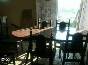 Oval shaped dining table with chairs