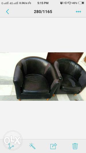 Two Black Leather Tub Chairs