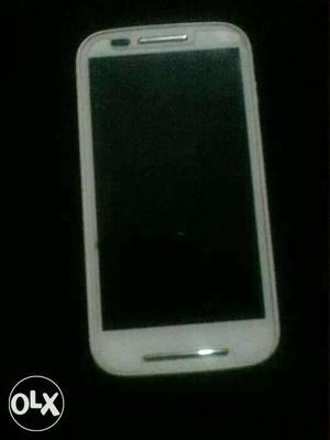 Motorola E first generation white mobile in