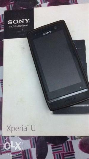 Sony Xperia U / black handset with a silicon cover