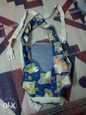Baby's White And Blue Baby Carrier
