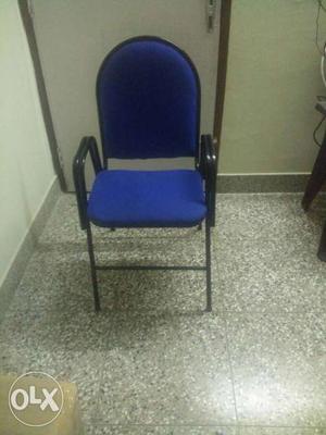 A near new steel chair with cushion and arm