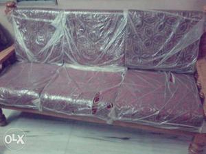 A newly bought 3 seaters comfortable wooden sofa