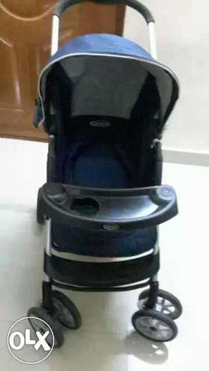 Baby's Blue And Black Stroller
