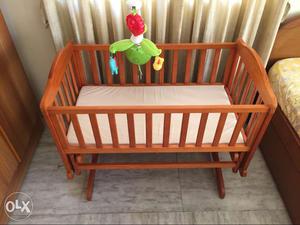 Baby's Brown Wooden Crib