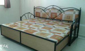 Brown And Black Framed Orange Mattress Bed
