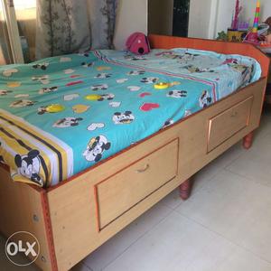 Brown And Orange Wooden Bed With Storage