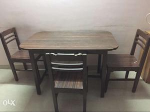 Brown Wooden Table And Three Chair Dining Set