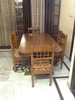 Teak wood dining table in royal look and natural