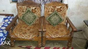 Two Brown Wooden Frame Armchairs