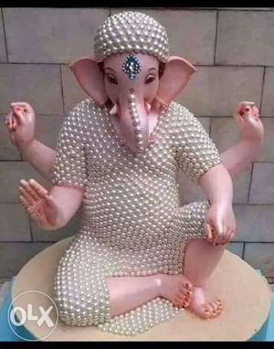 White And Beige Lord Ganesha Figurine