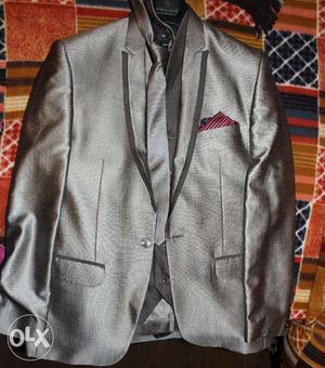 A Brand New 4 Piece Suit used only once