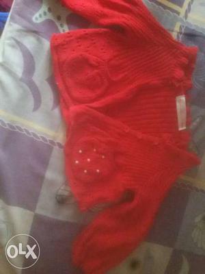 A cozy red full sleeve sweater best for your baby
