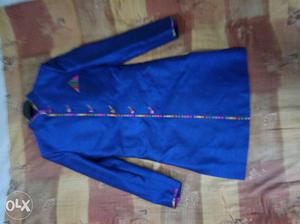 Dark blue colour sherwani with ethnic design on