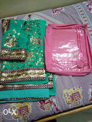 Green And Brown Floral Textile And Pink Bag