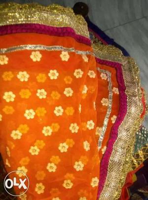 Orange Red And Gold Floral Textile