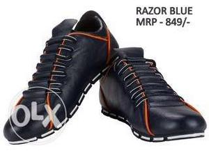 Pair Of Black Razor Blue Low Top Sneakers