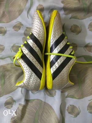 Pair Of Yellow And Gray Adidas Athletic Shoes