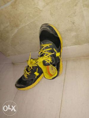 This pair is yellow black running shoes. Size-7,