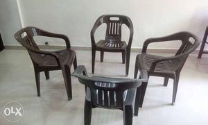4 Brown Monoblock Chairs