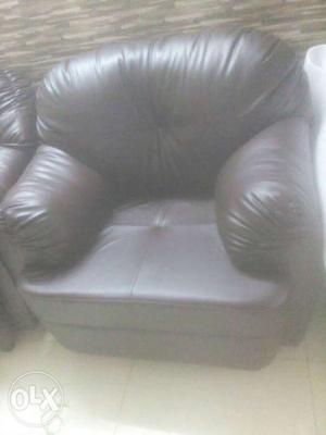 Brand new one seater unpacked leather sofa for