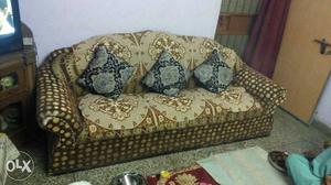 Brown And Green Padded Sofa