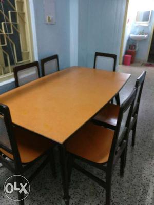Brown Rectangular Dining Table With Chairs