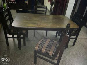 Brown Wooden Dinning table with 4 chairs