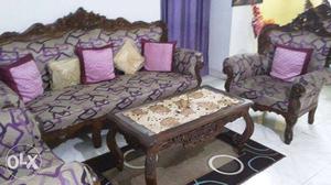 Good quality wooden sofa along with centre table