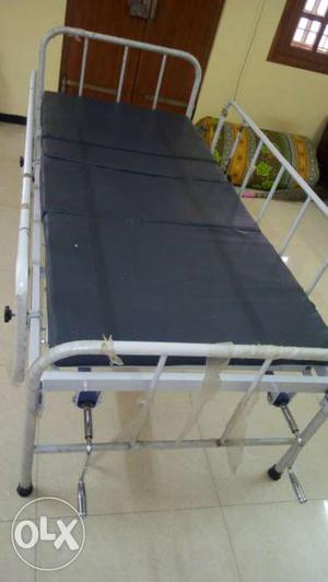 Medical cot with head and leg adjustments + air bed