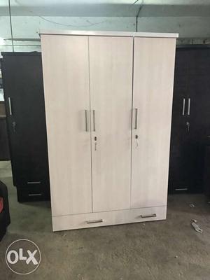 New 3 door Wardrobe in pine/white,good quality