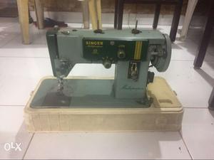 Singer Sewing Machine 4 years old in good condition.