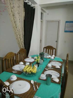 Six seater wooden dining table set for sale