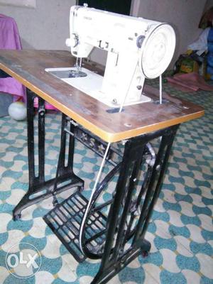 White And Brown Treadle Sewing Machine