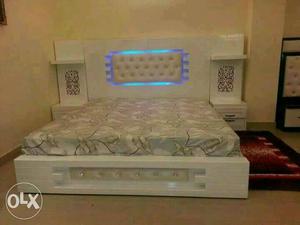 White LED double bed with side tables