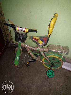 Yellow And Green Bicycle With Training Wheels