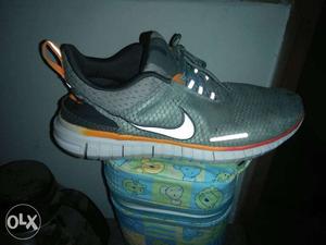 Gray And White Nike Running Shoes