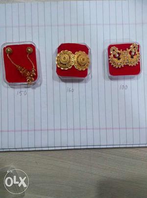 Three Pairs Of Gold Earrings