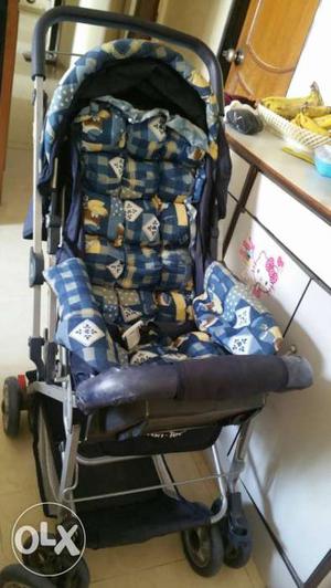 Baby's Blue White And Black Stroller