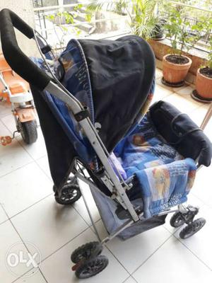 Baby's Silver And Black Stroller