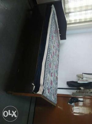 Black And Brown Wooden Bed 4*6 having storage box..