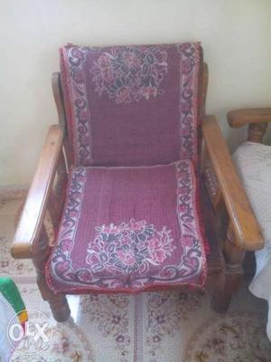 Brown Wooden Frame Base And Purple Floral Padded Armchair