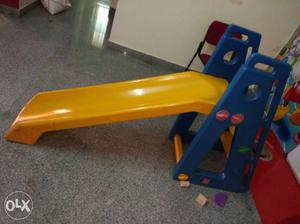 Child's Yellow And Blue Plastic Slide