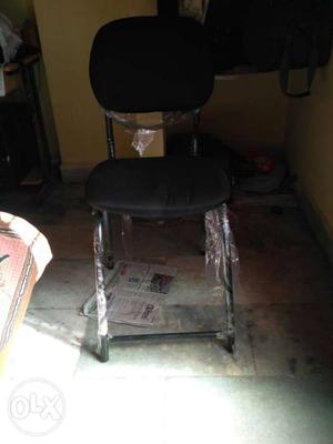 Stainless Steel And Black Padded Chair